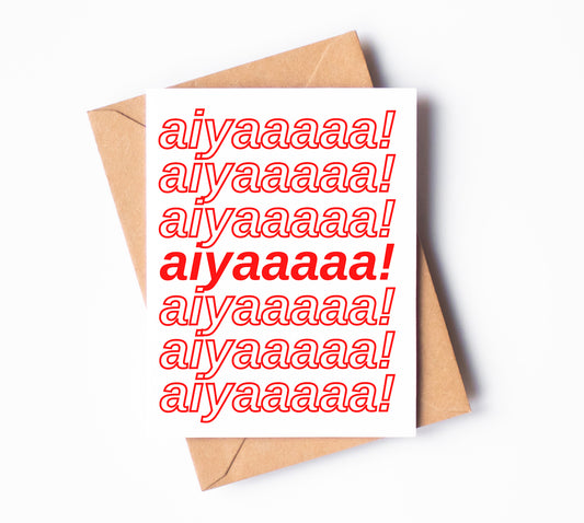 A white greeting card with "aiyaaaaa!" written seven times on it.