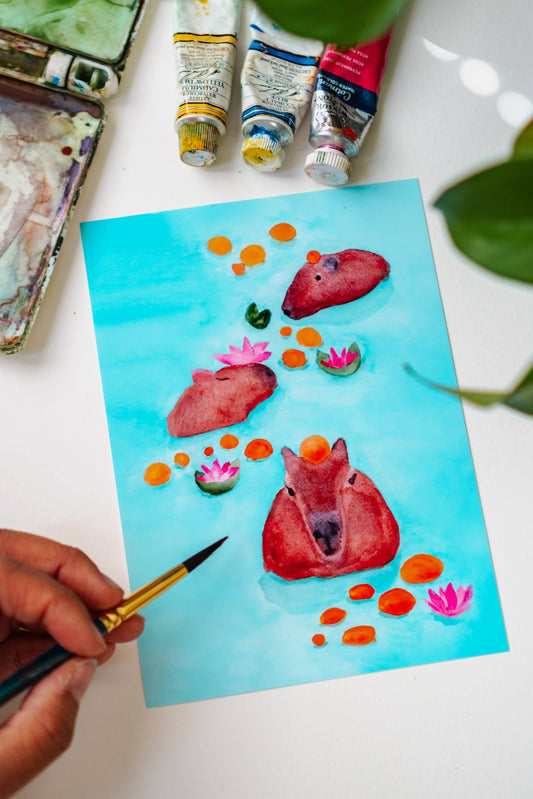 A photo of Menmin Made painting the Capybaras Swimming in Oranges Art Print.
