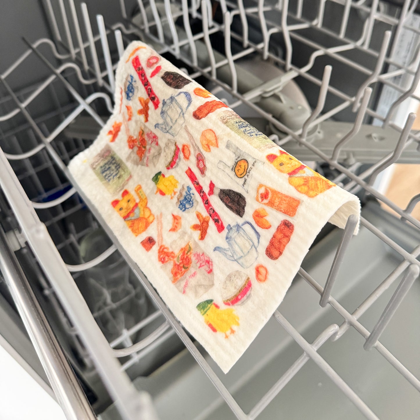 Swedish dishcloth with classic Chinese takeout items in the kitchen