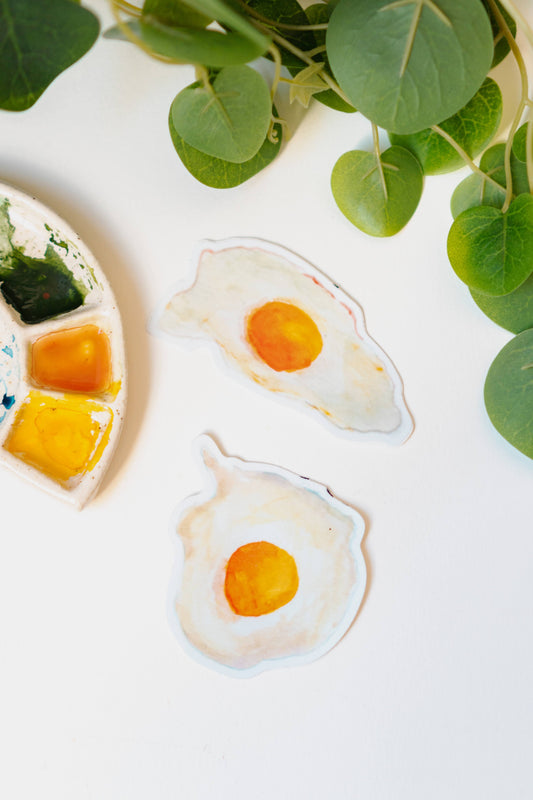 Menmin Made's two fried egg stickers, including the Round Egg Sticker.