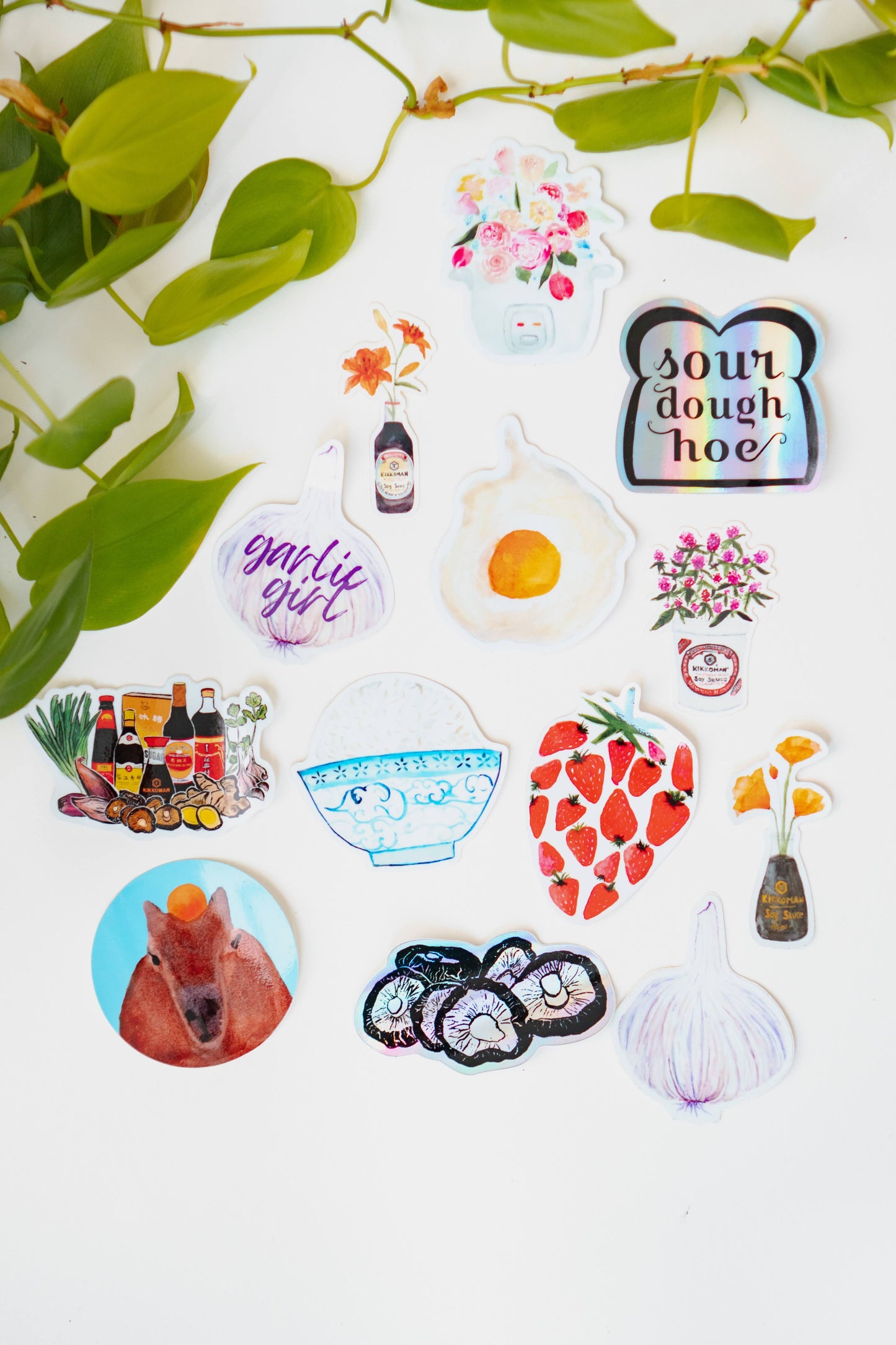 A collection of Menmin Made's food stickers, including the Tiger Lily in Soy Sauce Sticker.