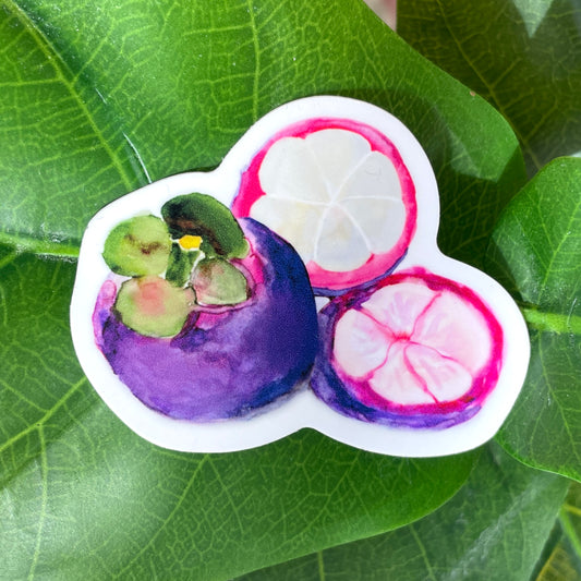 A purple and white mangosteen sticker. One mangosteen is cut open, exposing tender white slices of fruit inside.