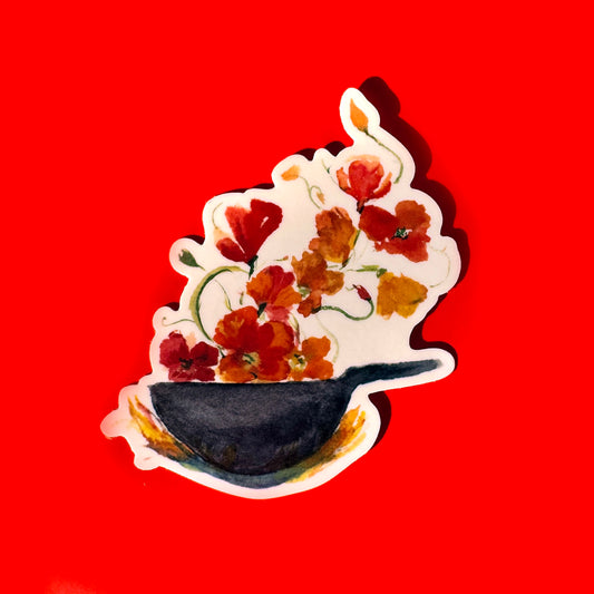 sticker of red and yellow flowers blooming from a black wok