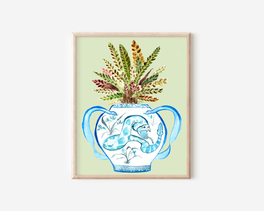 A print of a rattlesnake plant in a blue and white porcelain vase, decorated with a snake.