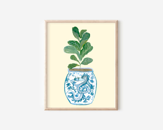 A print of a fiddle-leaf fig plant in a blue and white porcelain vase, decorated with a dragon.