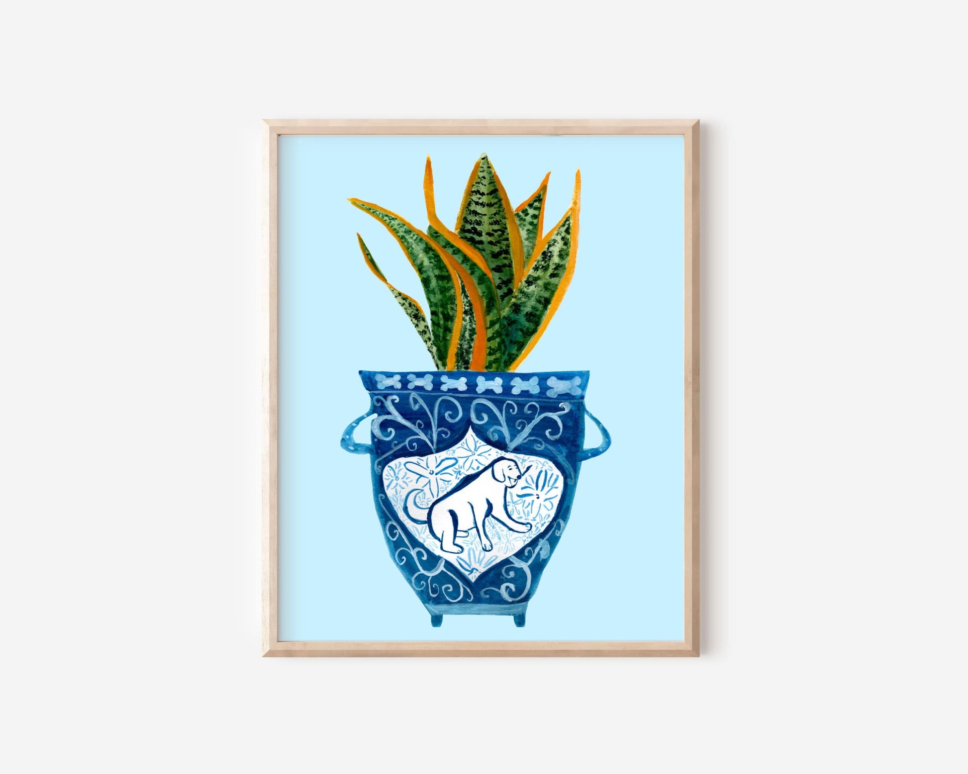 A print of a snake plant in a blue and white porcelain vase, decorated with a dog.