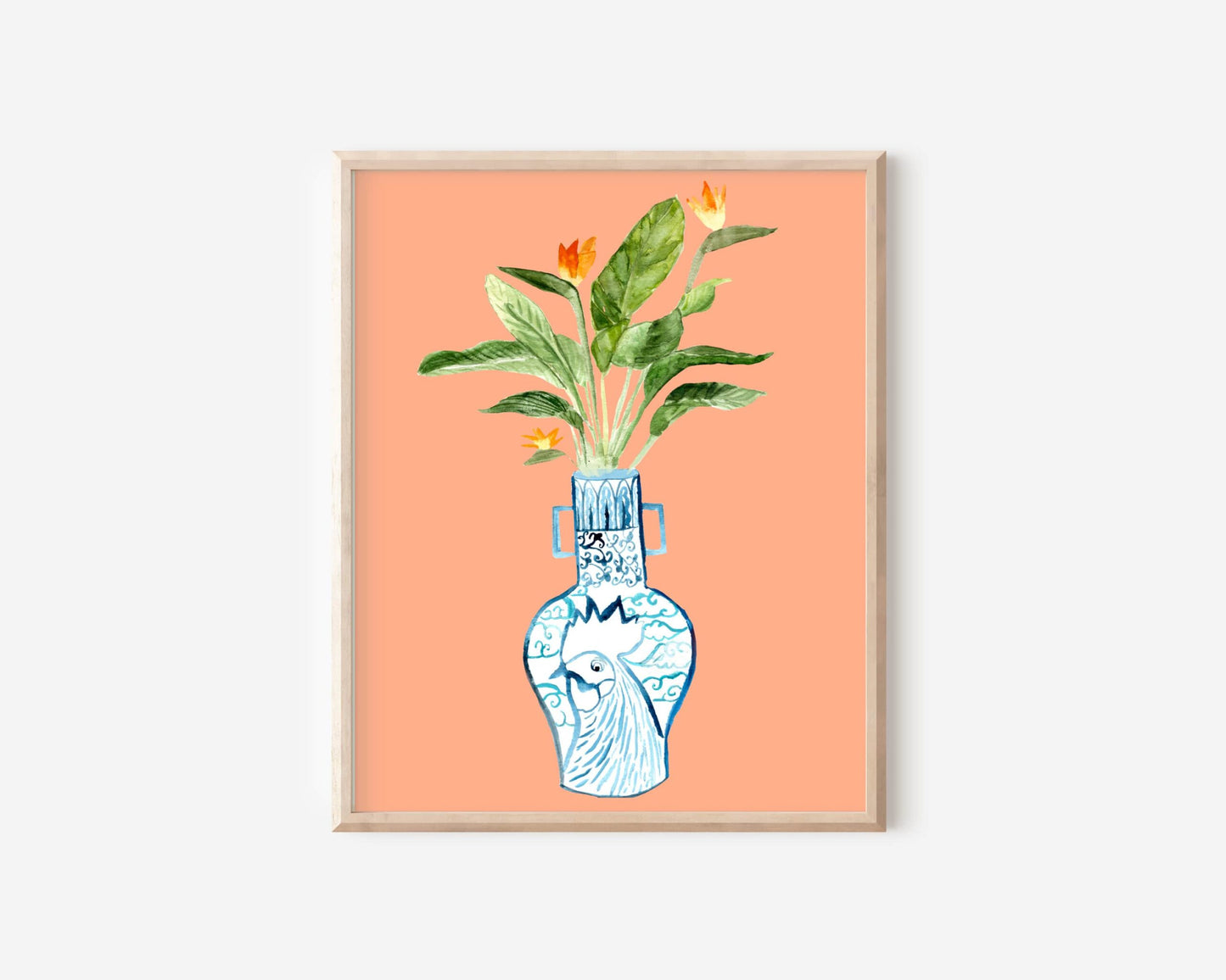A print of a bird of paradise plant in a blue and white porcelain vase, decorated with a rooster.