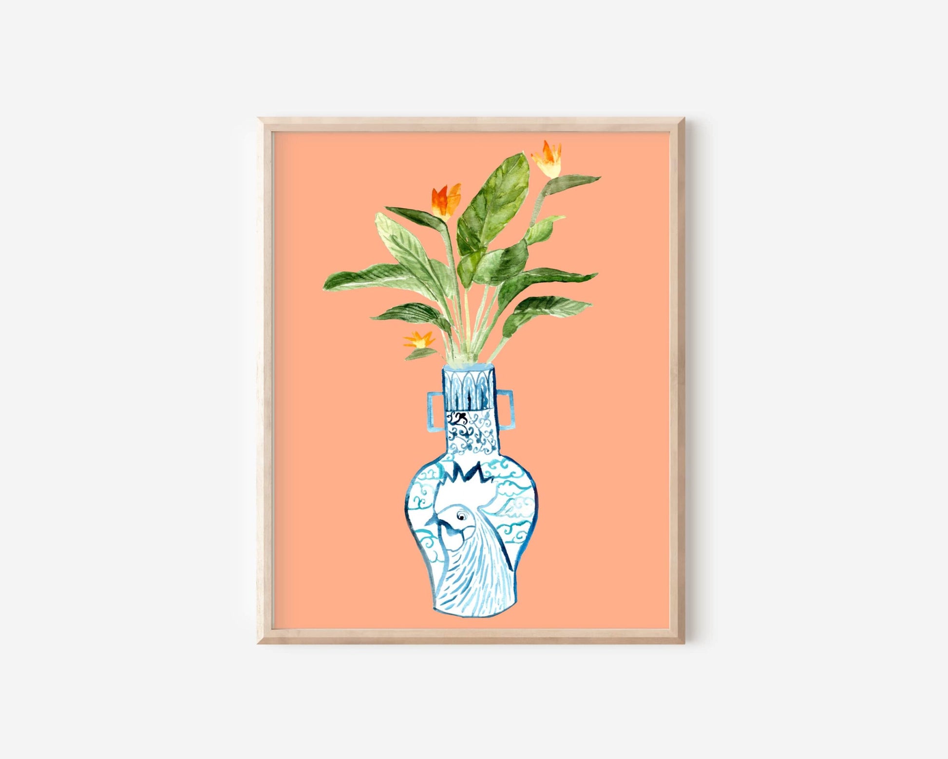 A print of a bird of paradise plant in a blue and white porcelain vase, decorated with a rooster.