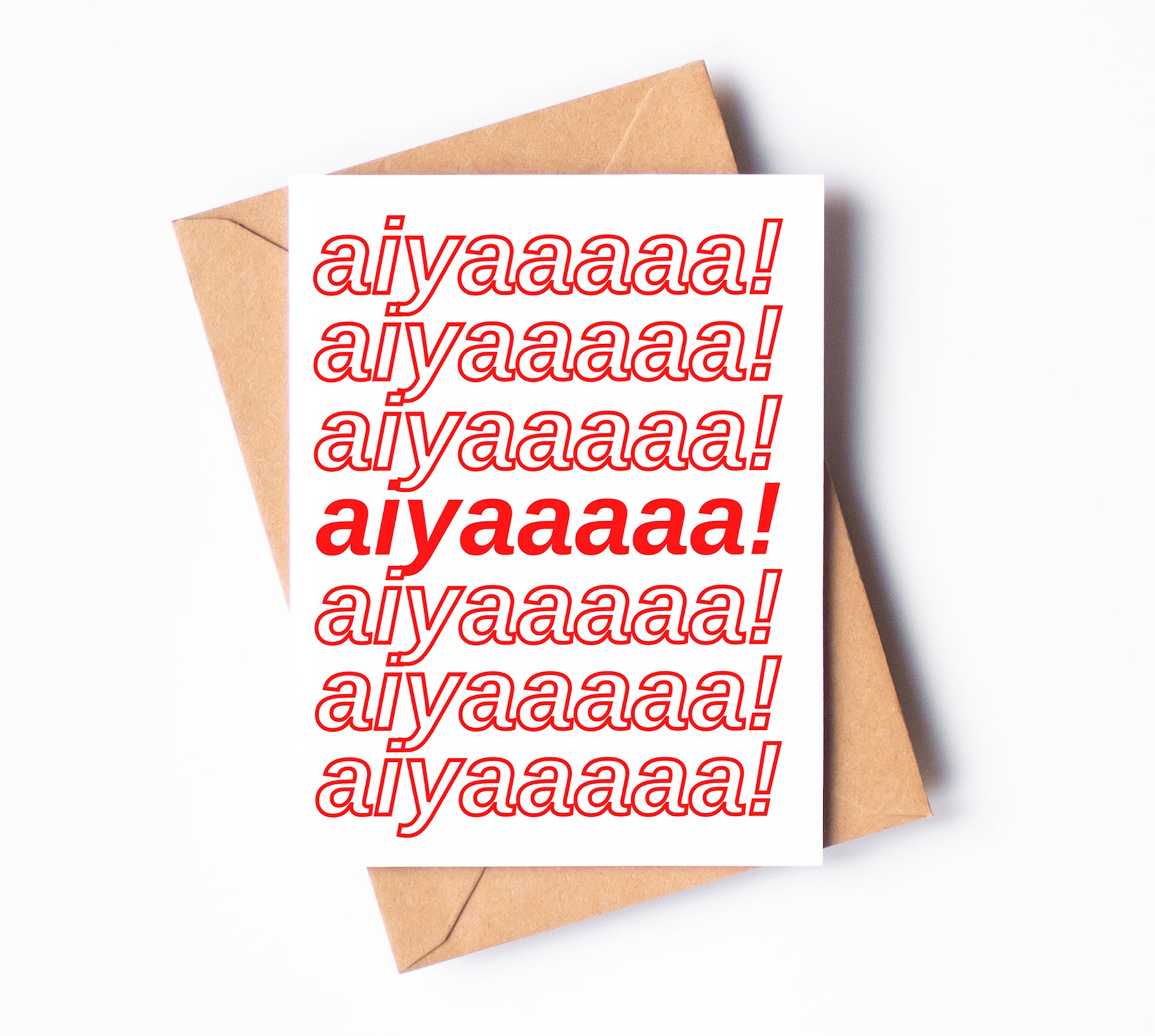A white greeting card with "aiyaaaaa!" written seven times on it.