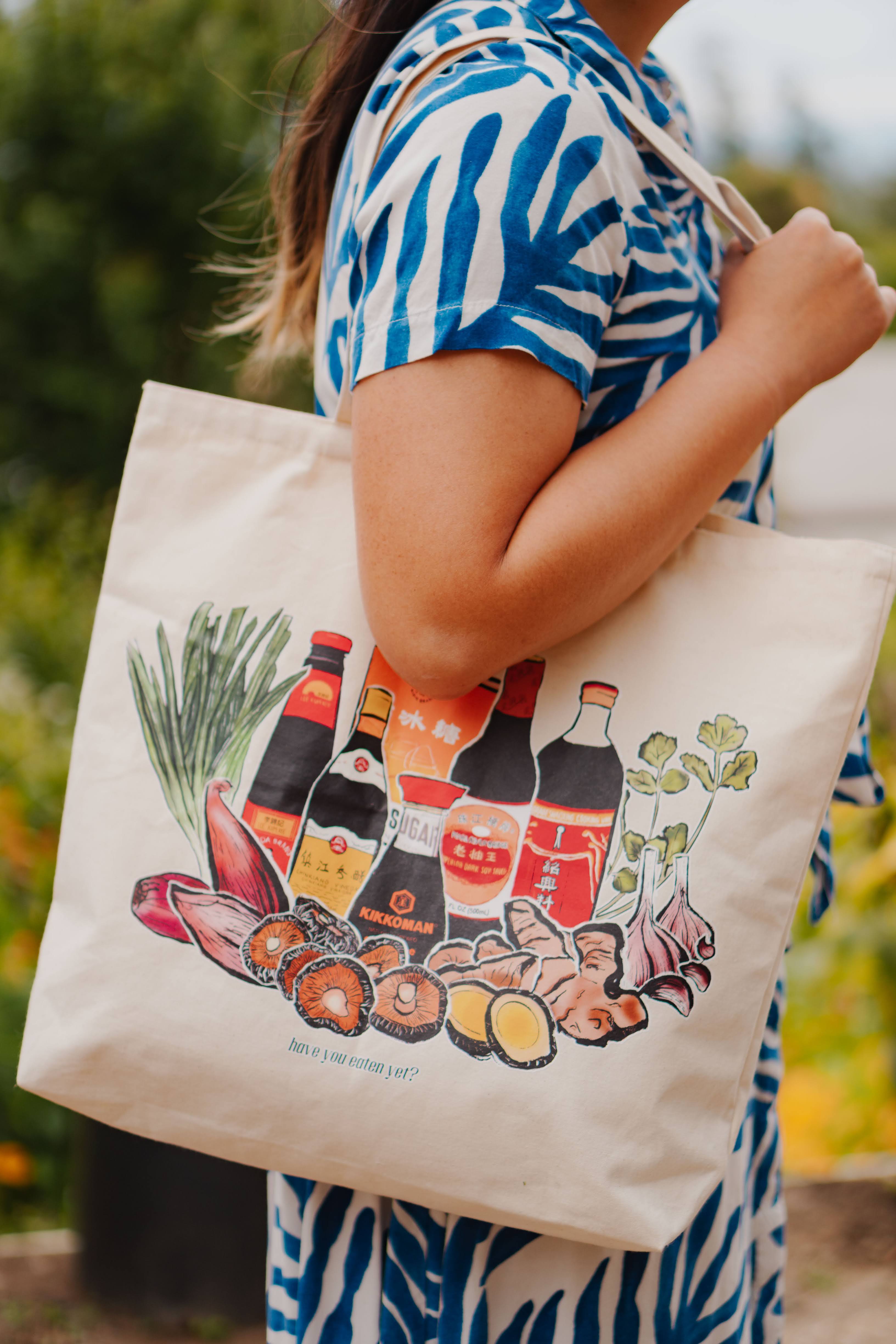 Premium Photo | Happy asian pretty girl holding shopping bags while using  smartphone