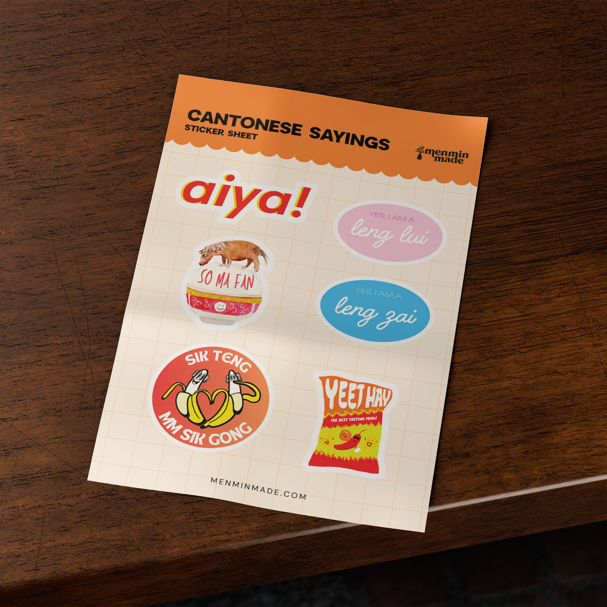 Cantonese Sayings sticker sheet on a wooden table