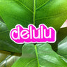 A pink and white sticker that reads "delulu" in a Barbie-like font.