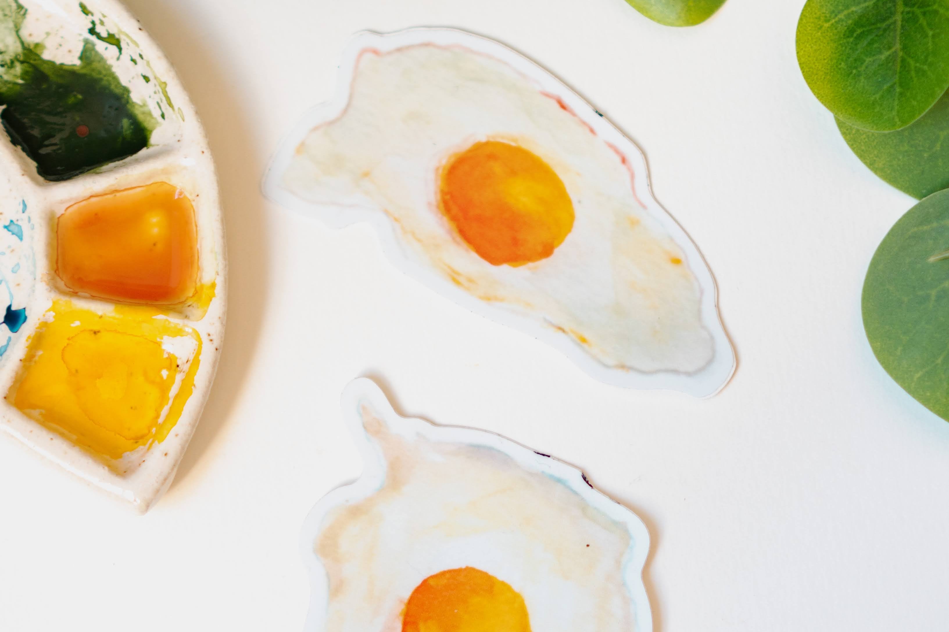 Menmin Made's two fried egg stickers, including the Round Egg Sticker.