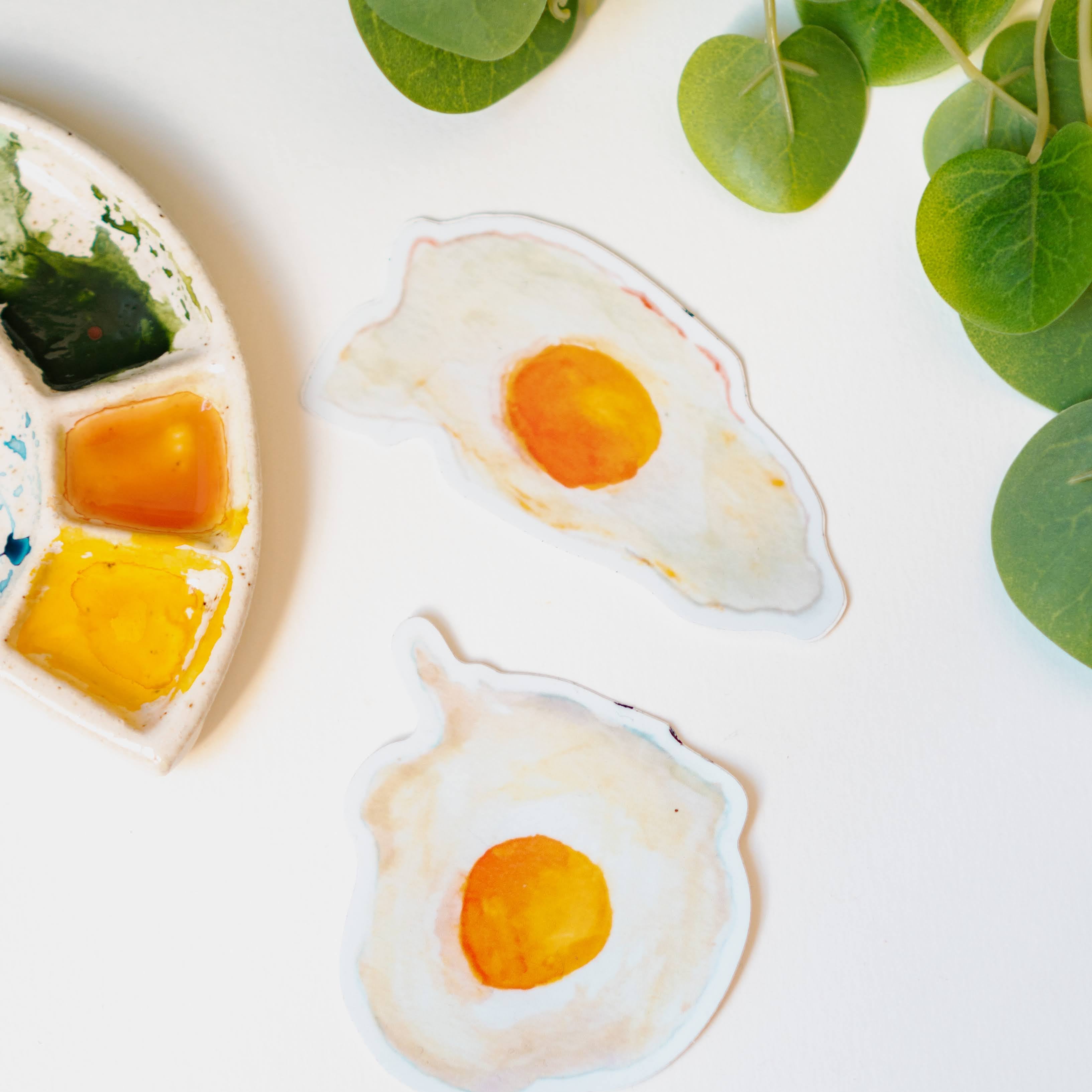 Menmin Made's two fried egg stickers, including the Round Egg Sticker.