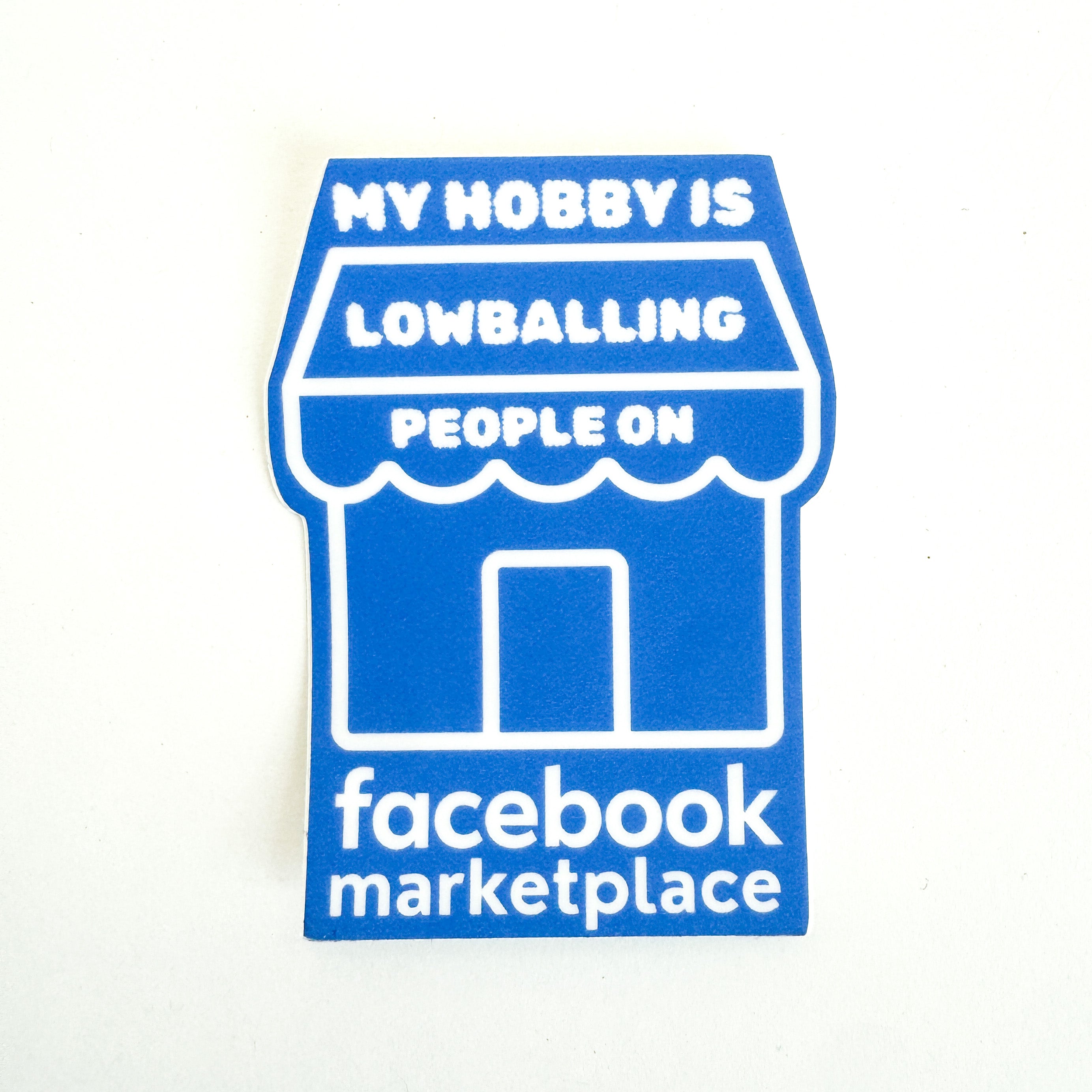 Funny Facebook Marketplace sticker that reads "My Hobby Is Lowballing People On Facebook Marketplace," blue and white die-cut vinyl decal shaped like a storefront