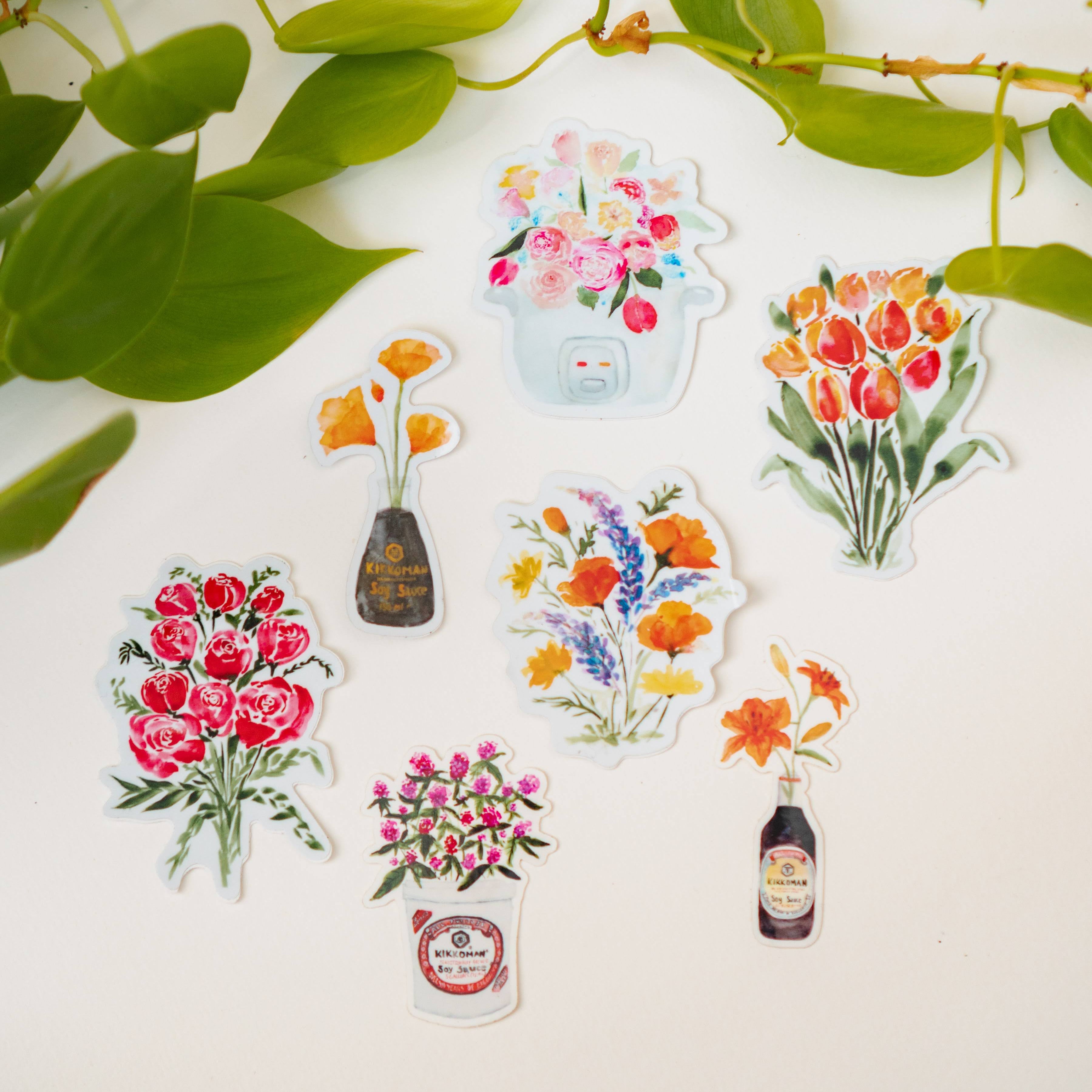 Seven stickers combining flowers and food-related items, including the artist's Soy Sauce Genesis series.
