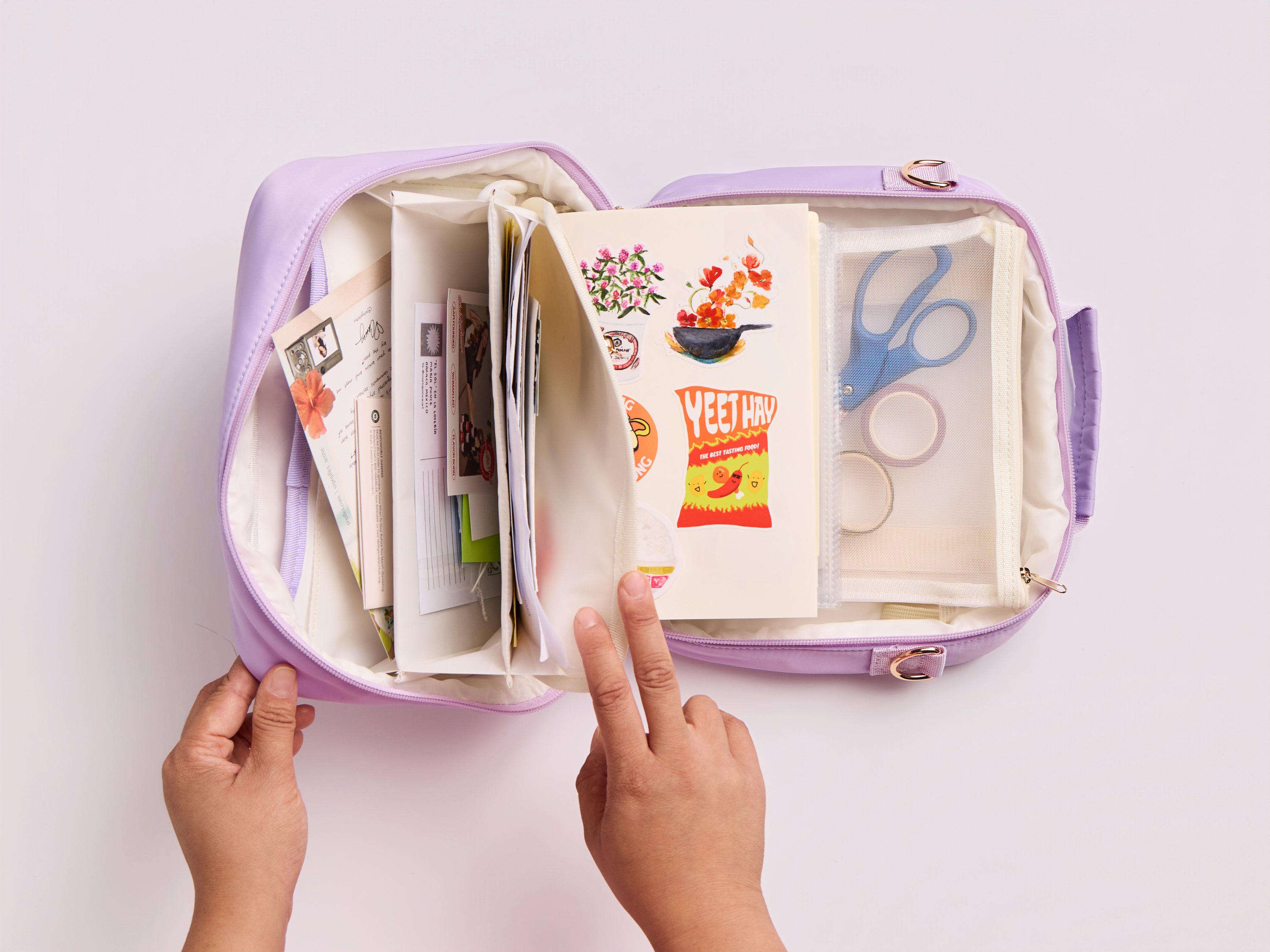 Lavender Ultimate Journal Bagwith scissors, paper, and other supplies on a white background