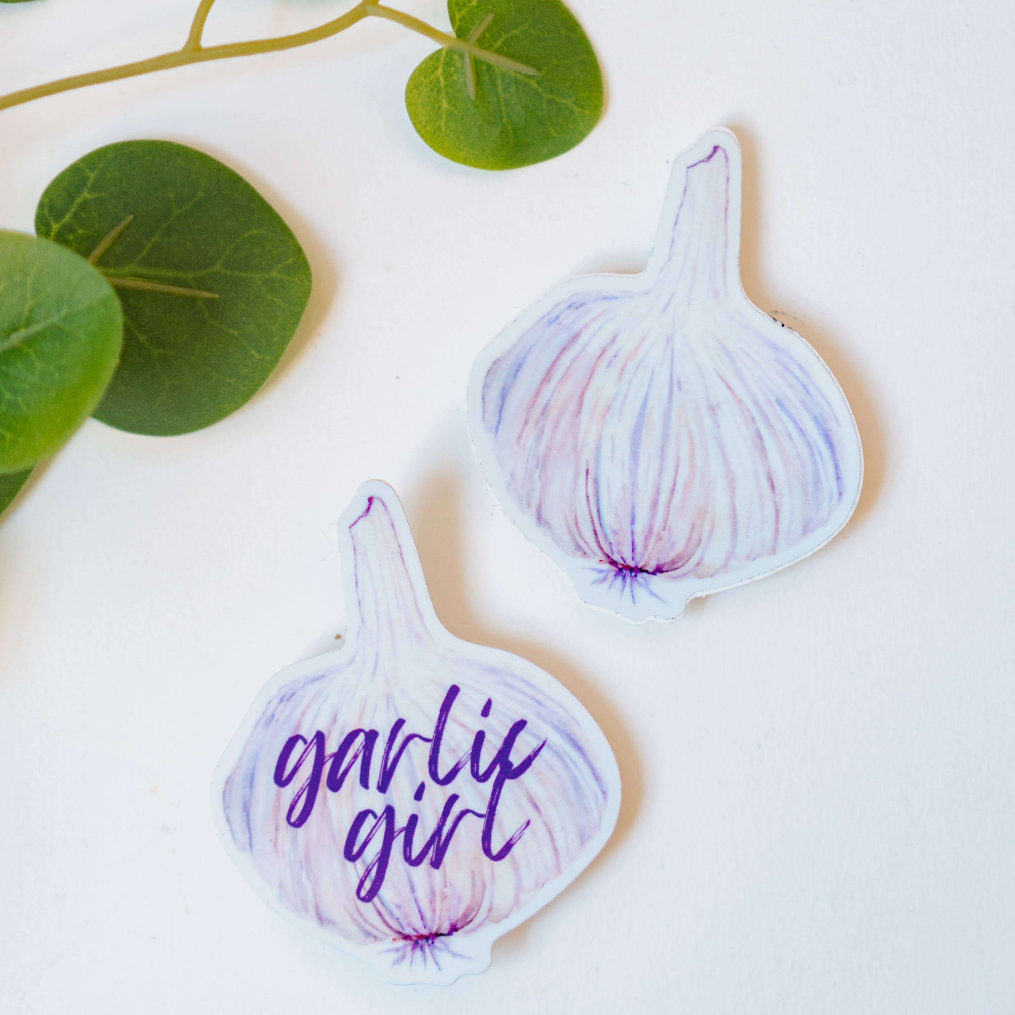 Two garlic bulb stickers, including the Garlic Girl Sticker.