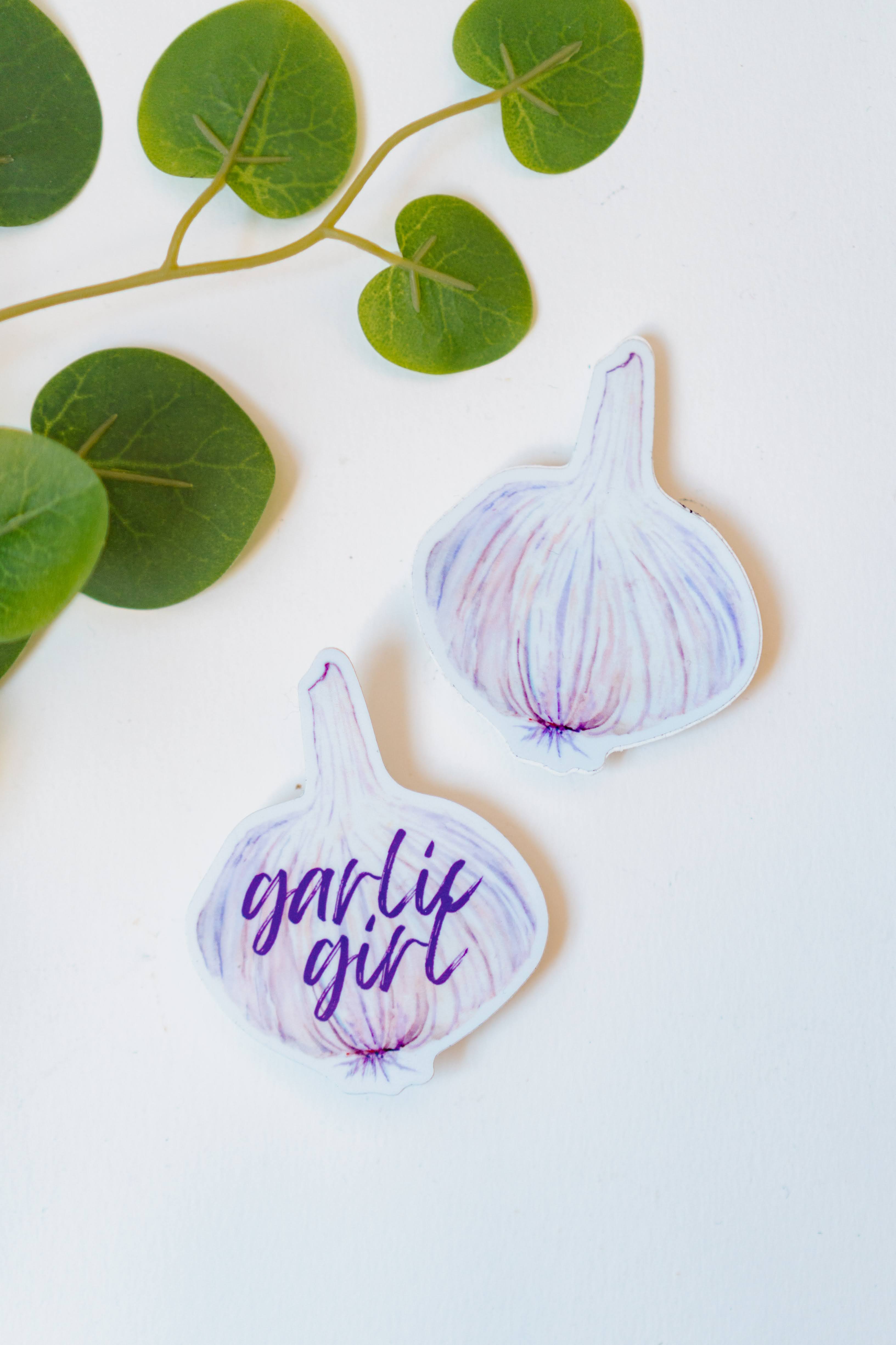 Two garlic bulb stickers, including the Garlic Girl Sticker.