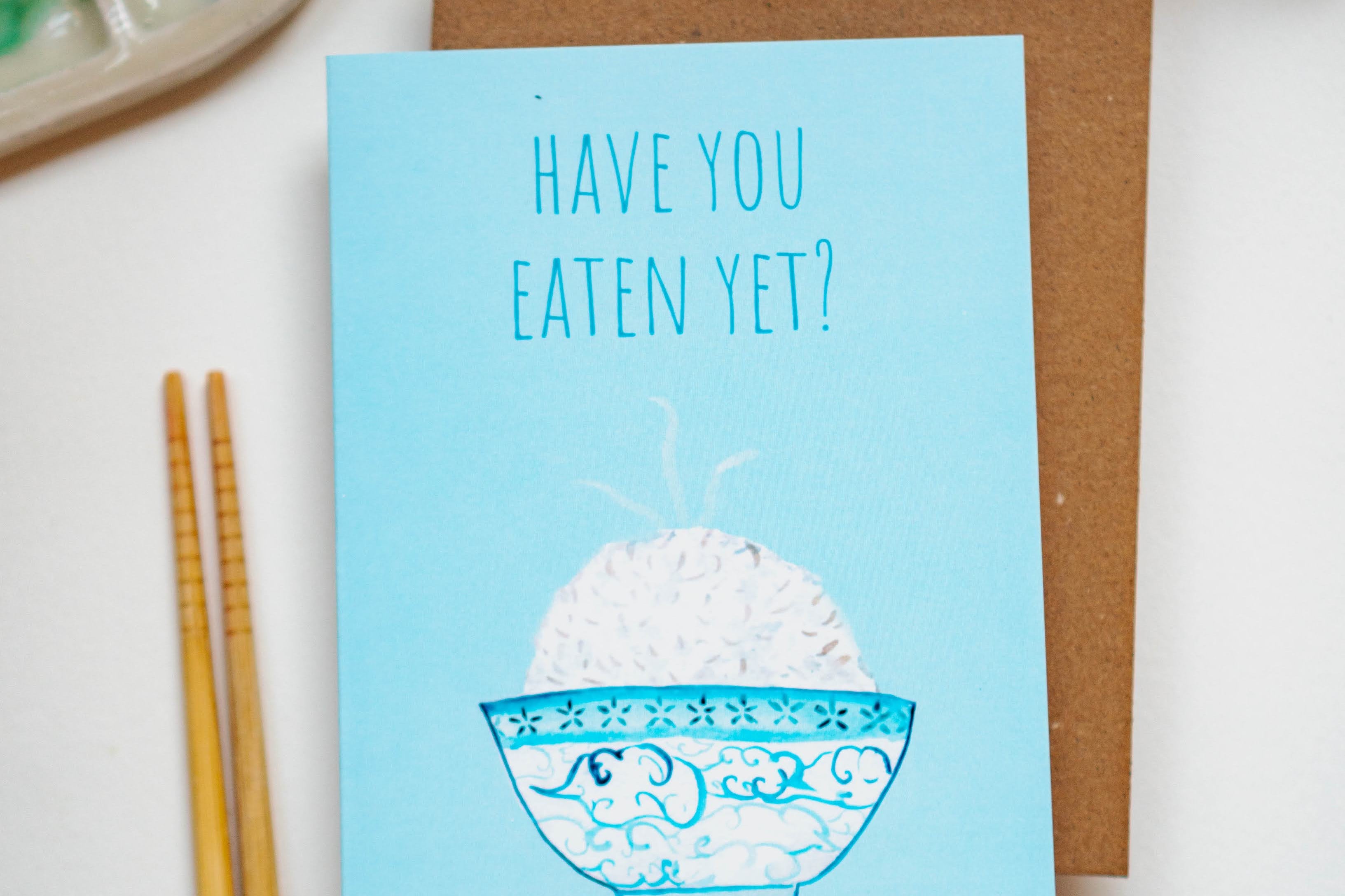 Have You Eaten Yet Greeting Card with Rice Bowl and chopsticks next to it