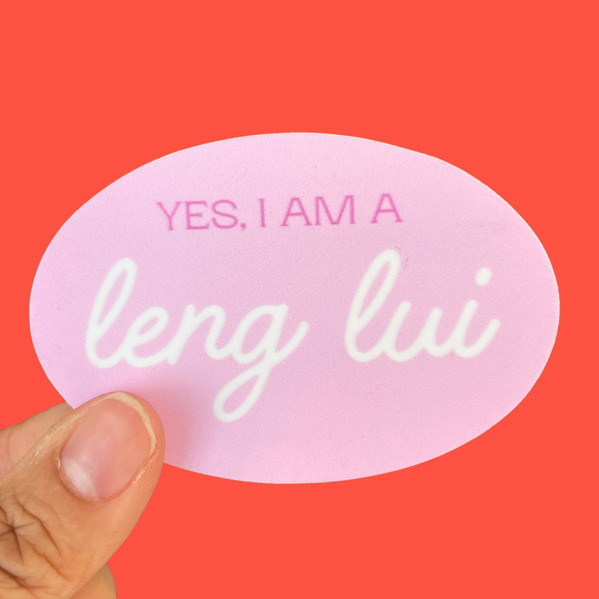 A light pink sticker with the words "Yes, I am a leng lui" written on it.