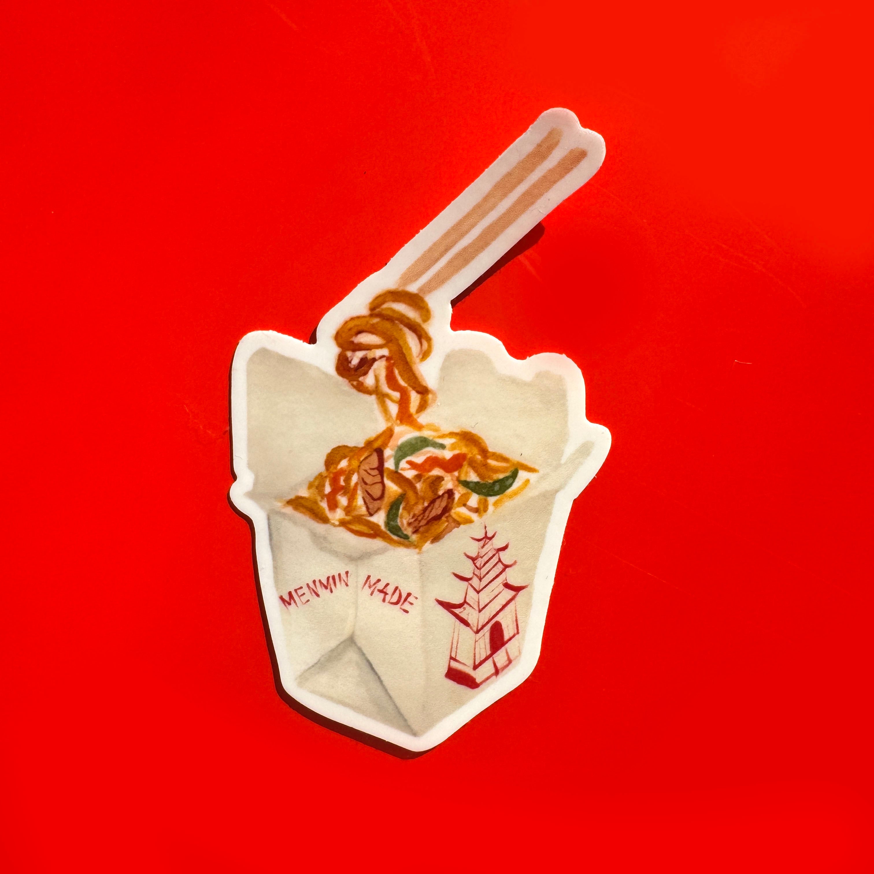 sticker of Chinese Lo Mein noodles in a take out box and a pair of chopsticks