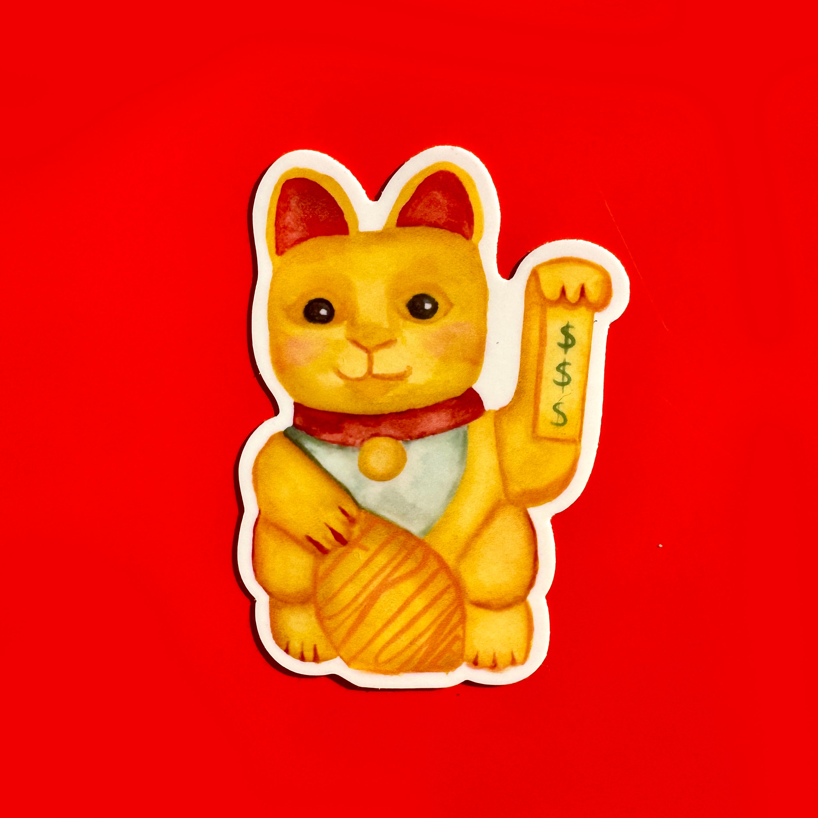 sticker of a yellow lucky cat and dollar signs