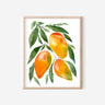 A watercolor print of three orange and green mangos hanging from a branch of leaves.