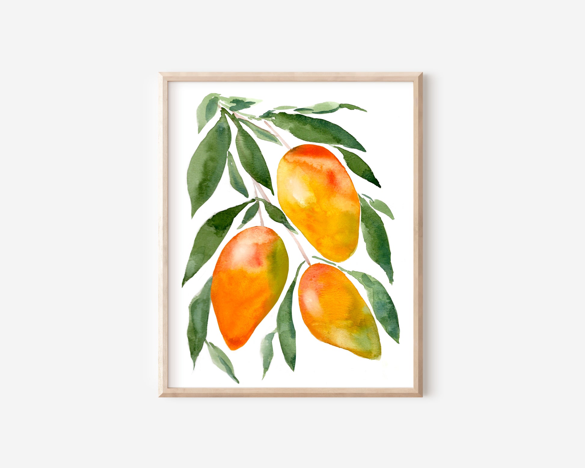 A watercolor print of three orange and green mangos hanging from a branch of leaves.