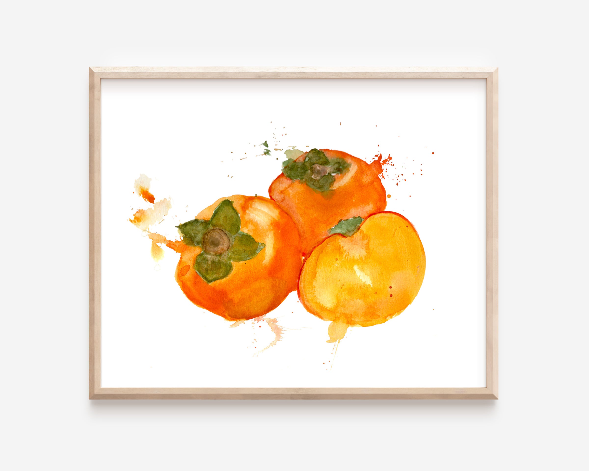 A print of three rich, orange watercolor persimmons. One persimmon is cut open to display the soft yellow-orange inside.