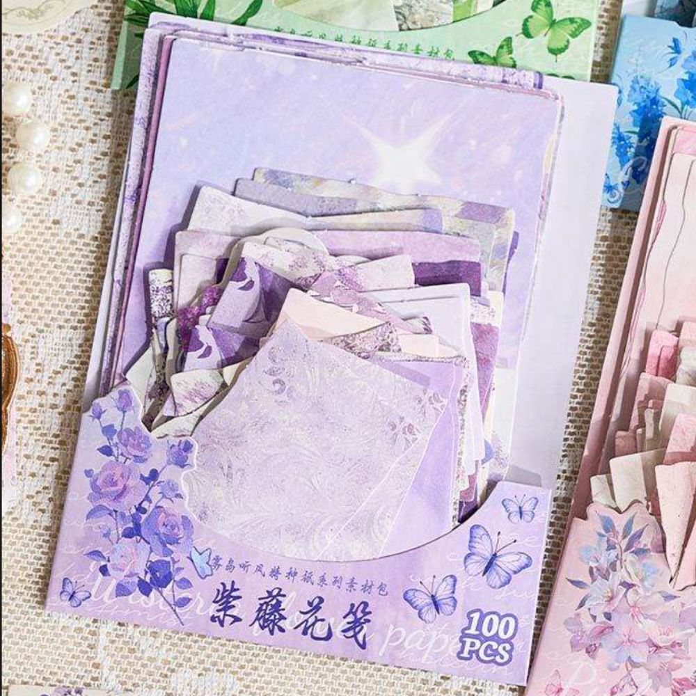 100-sheet purple vintage scrapbook paper pack — floral, damask, lace, and starlit prints in lavender and plum