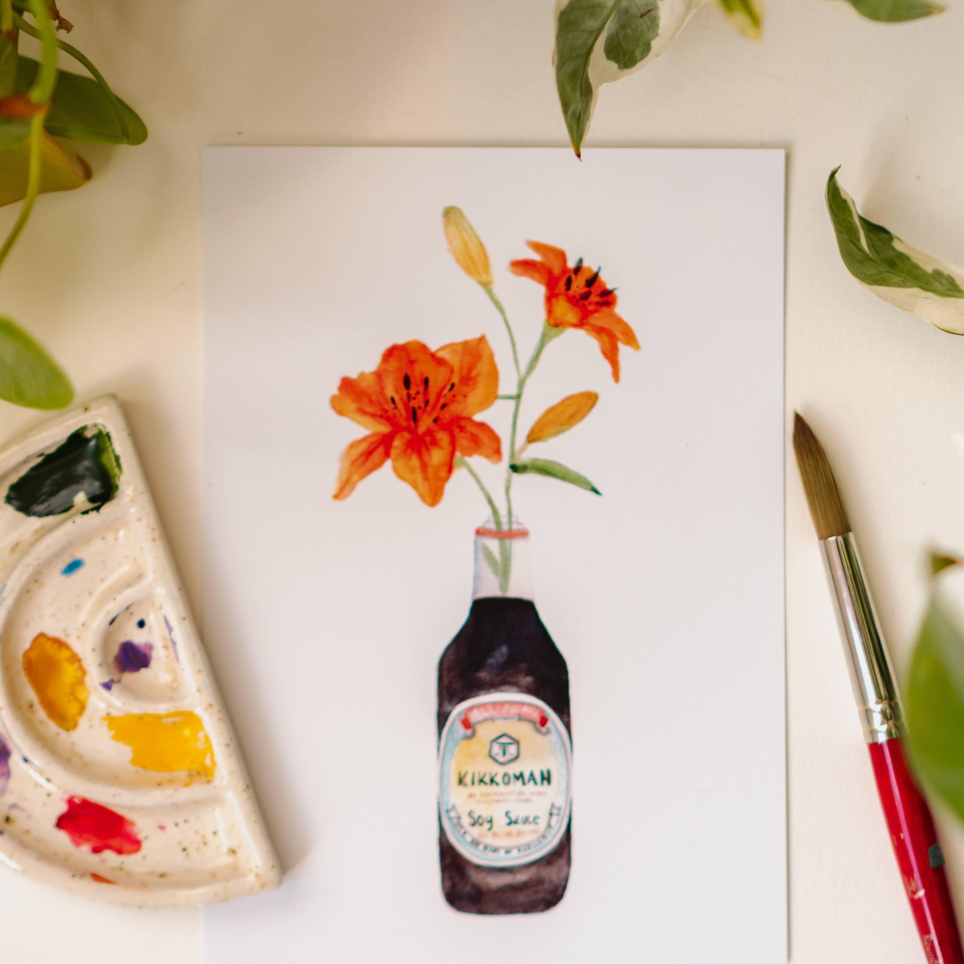 A watercolor art print of two orange tiger lilies in a Kikkoman soy sauce bottle.