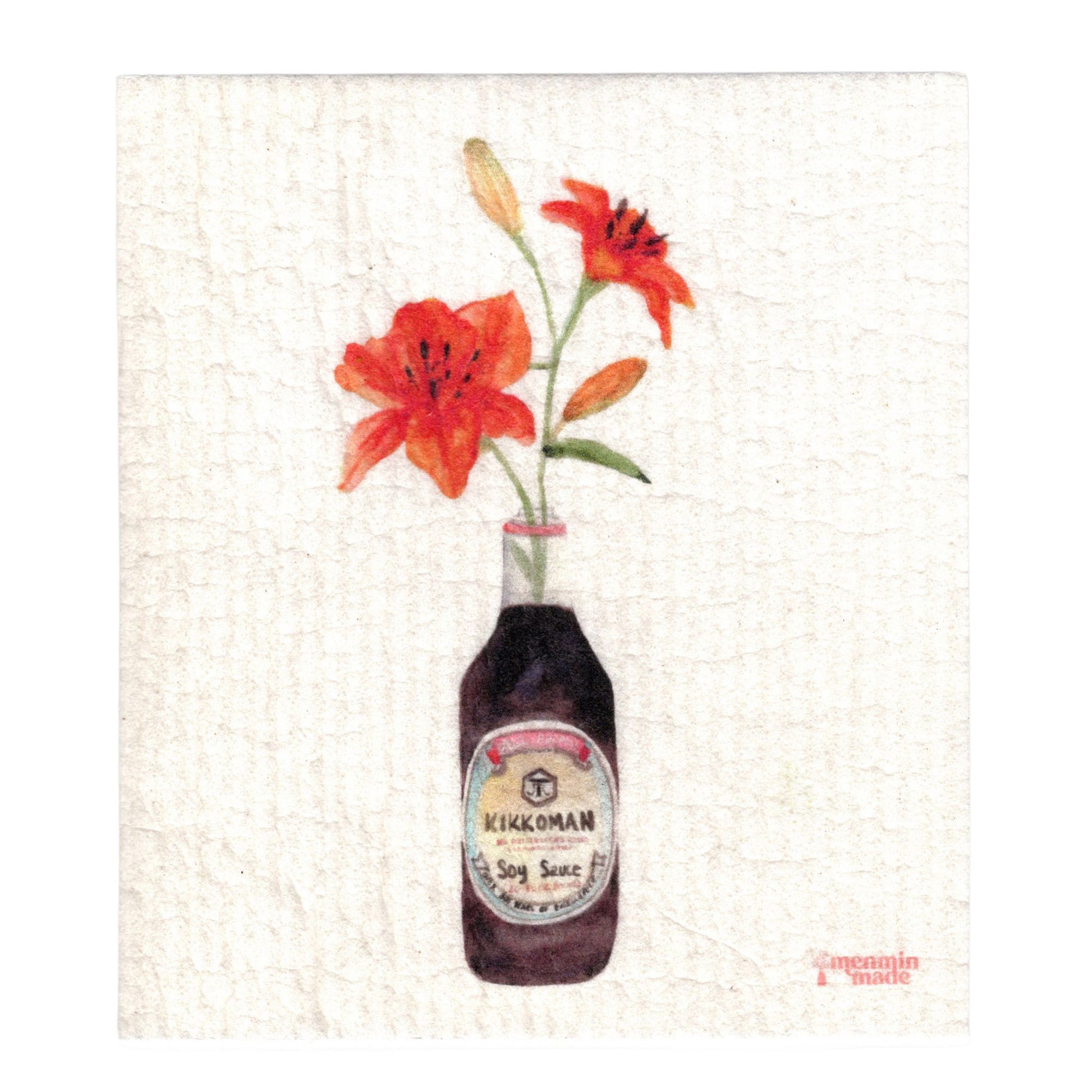 A textured Swedish dish cloth of two orange tiger lilies in a Kikkoman soy sauce bottle.