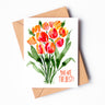 A greeting card depicting orange and red watercolor tulips on green stems. The words "You are the best!" are written in the bottom right corner.