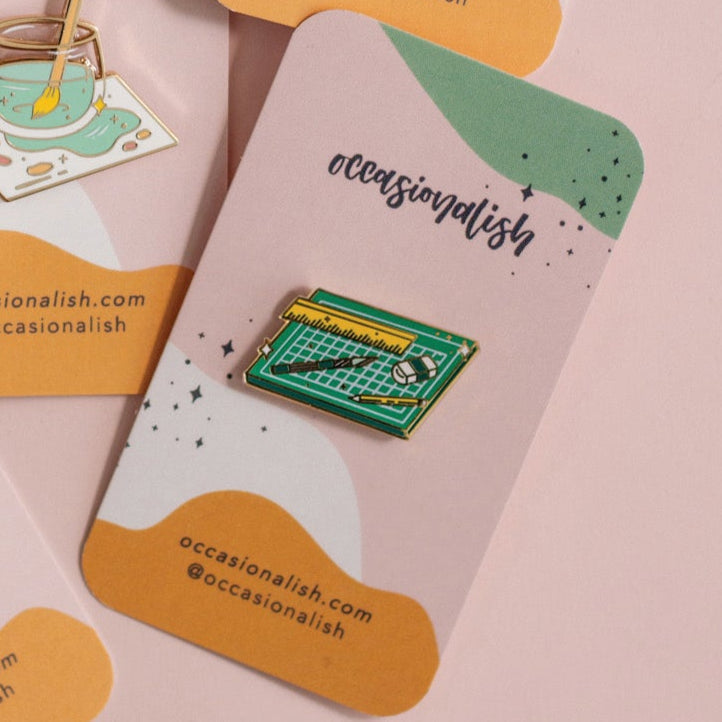 Cut and Create enamel pin styled