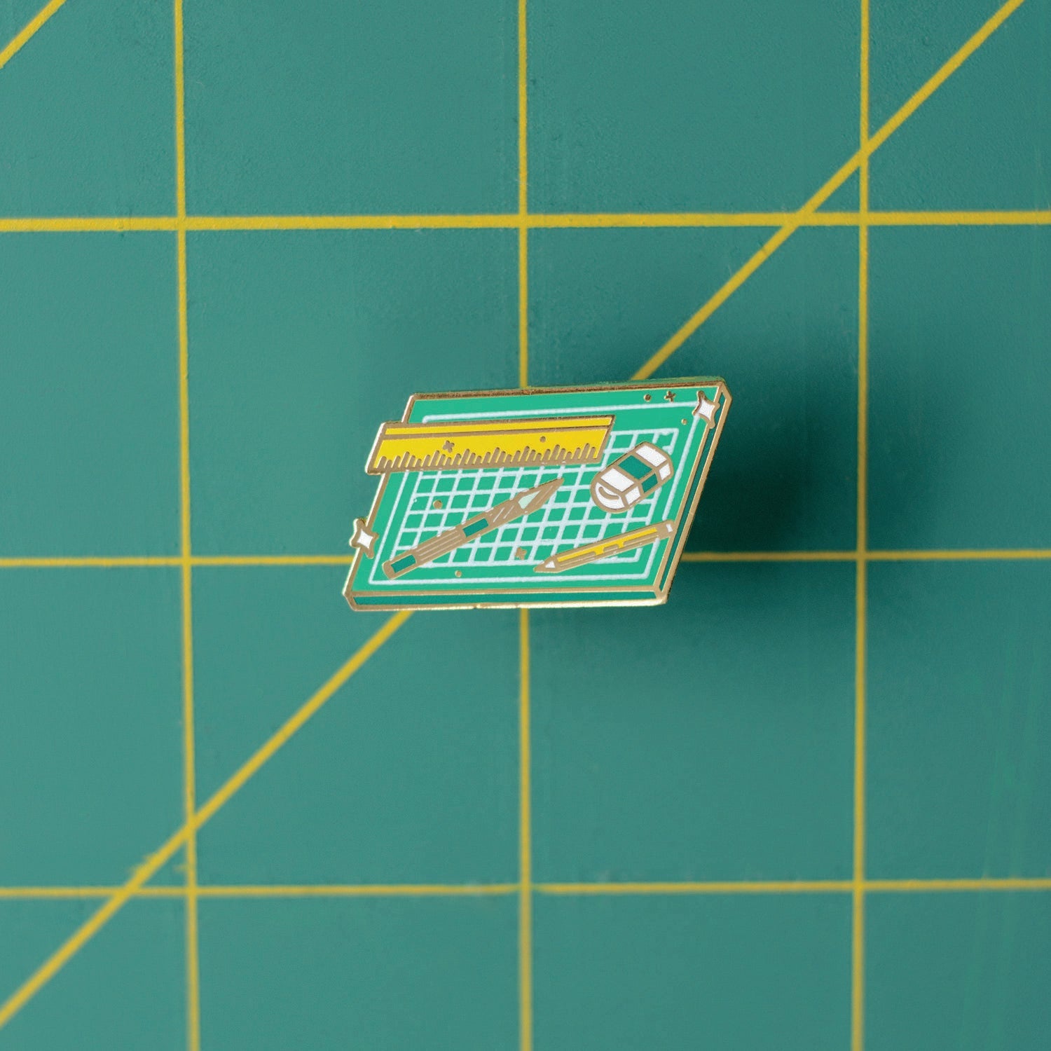 Cut and Create enamel pin close up
