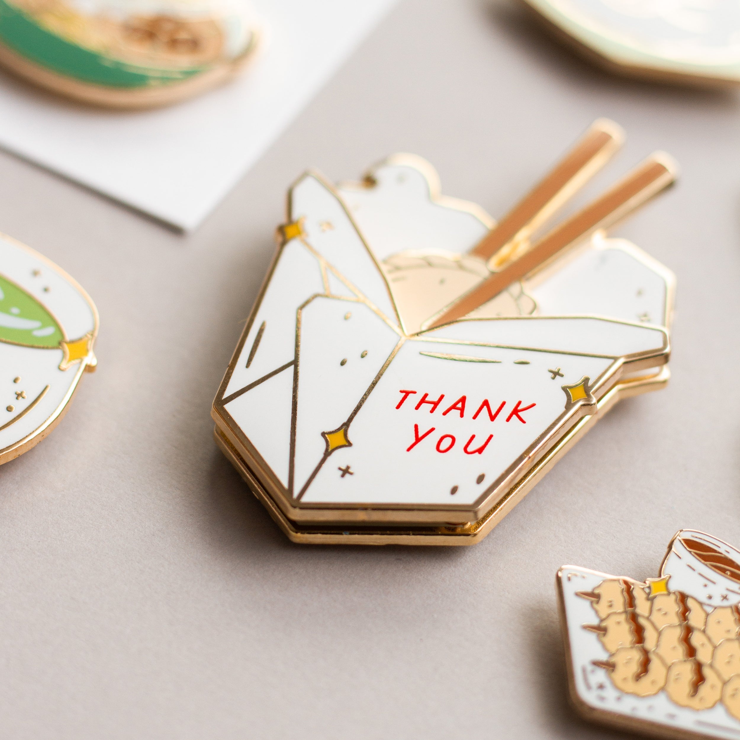 To-Go Box enamel pin styled