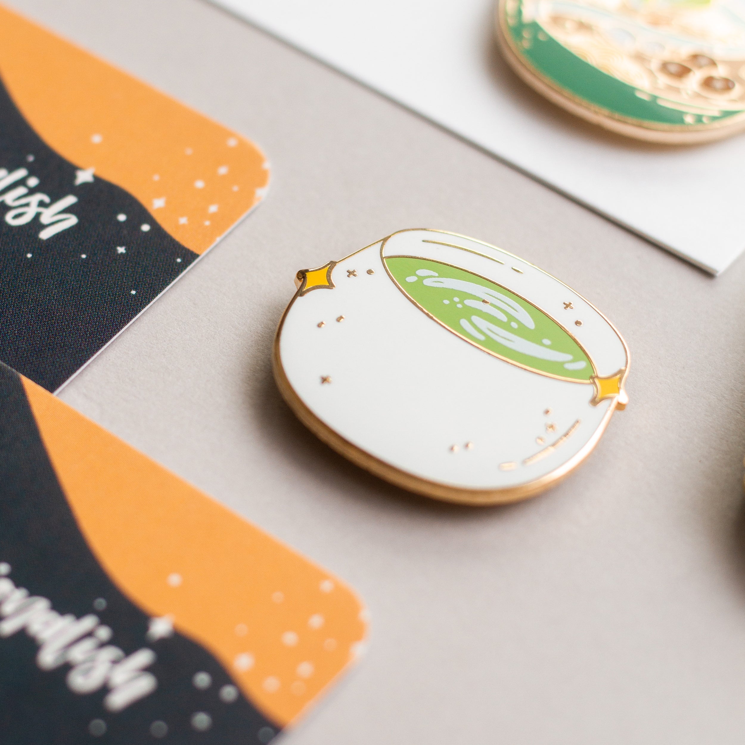 Matcha Latte enamel pin on fabric