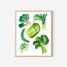 A white art print hung on a wall depicting green Chinese vegetables: cilantro, green onion, bok choy, and napa cabbage.