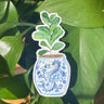 A sticker of a fiddle-leaf fig plant in a blue and white porcelain vase, decorated with a dragon.