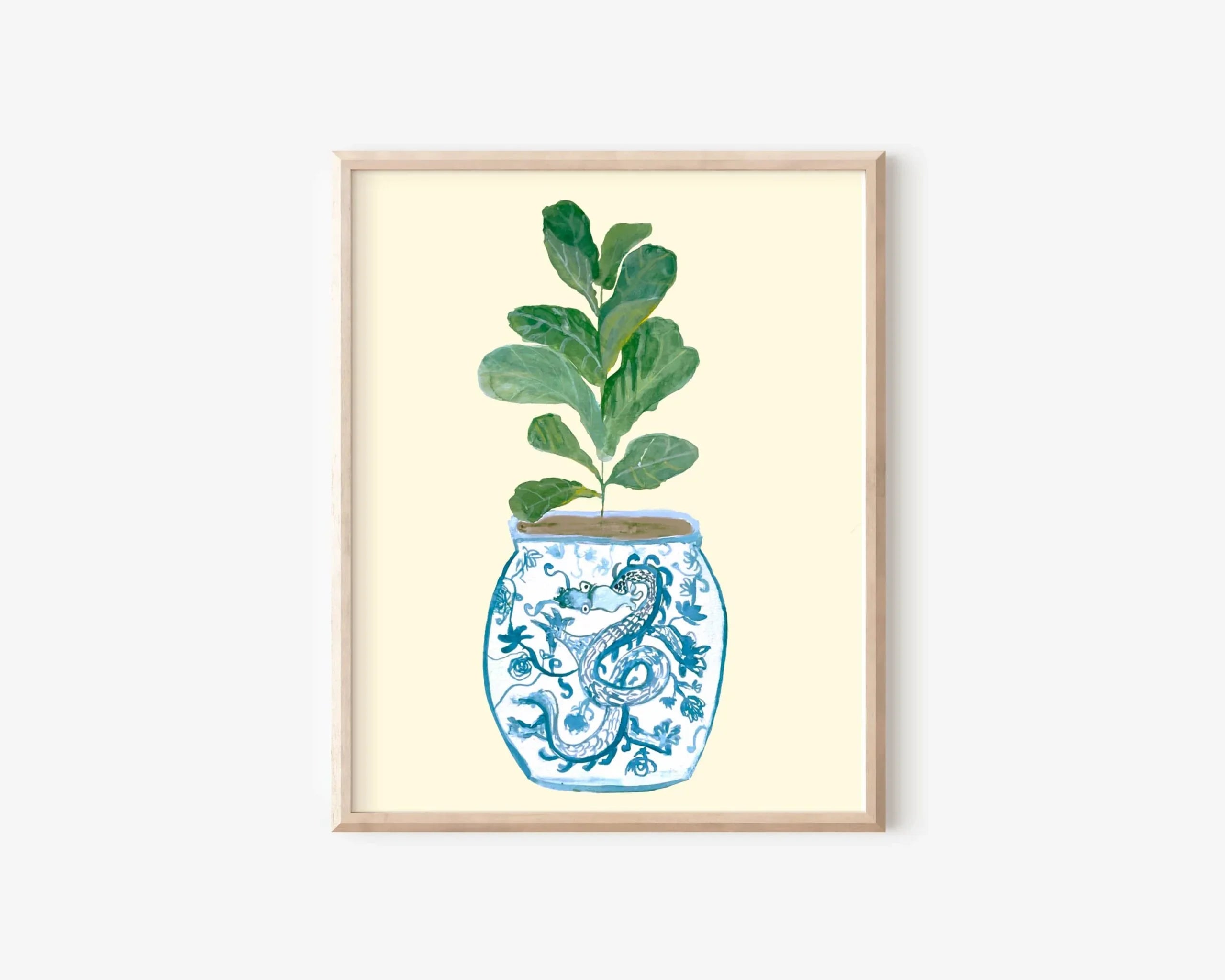 Framed art print of a fiddle leaf fig in a blue and white dragon-patterned vase, AAPI-inspired home decor