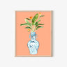 Blue and white vase with bird design, holding green leaves and orange flowers on peach background
