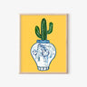 Framed art print with blue and white tiger vase holding green cactus on yellow background
